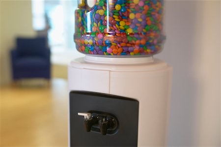 Water Cooler Filled with Candy in Office Stock Photo - Premium Royalty-Free, Code: 600-01195543