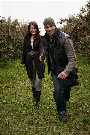 Couple in Apple Orchard Stock Photo - Premium Royalty-Free, Code: 600-01196557