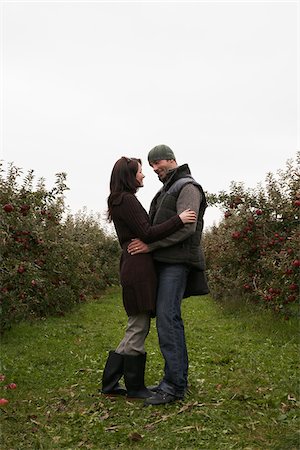Couple in Apple Orchard Stock Photo - Premium Royalty-Free, Code: 600-01196560