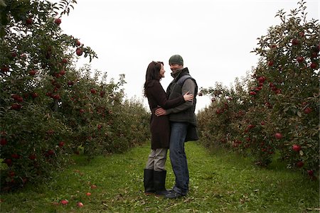 Couple in Apple Orchard Stock Photo - Premium Royalty-Free, Code: 600-01196561