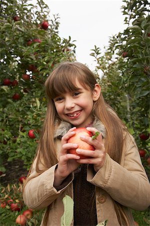 Child in Apple Orchard Stock Photo - Premium Royalty-Free, Code: 600-01196570