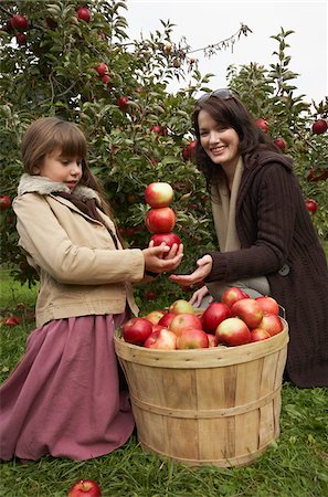 Mother and Daughter in Apple Orchard Stock Photo - Premium Royalty-Free, Code: 600-01196580