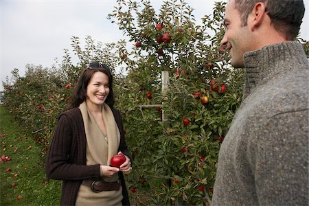 Couple in Apple Orchard Stock Photo - Premium Royalty-Free, Code: 600-01196593