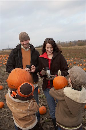 Family in Pumpkin Patch Stock Photo - Premium Royalty-Free, Code: 600-01196607