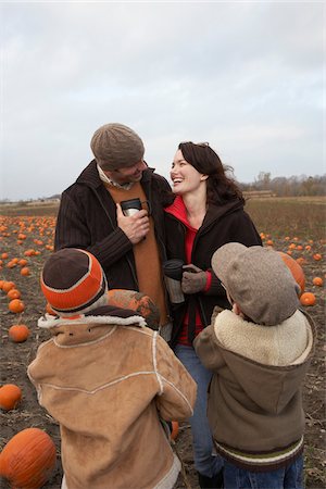 Family in Pumpkin Patch Stock Photo - Premium Royalty-Free, Code: 600-01196608