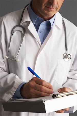 simsearch:600-01235402,k - Doctor Taking Notes Stock Photo - Premium Royalty-Free, Code: 600-01199174