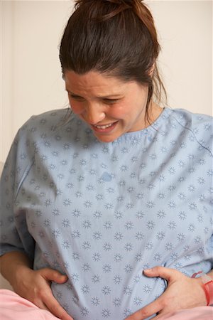 Pregnant Woman Having Contractions Stock Photo - Premium Royalty-Free, Code: 600-01199654