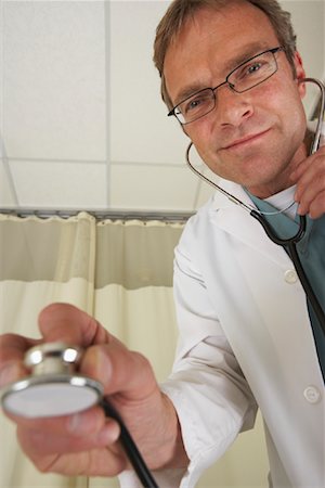 simsearch:600-01235402,k - Doctor with Stethoscope Stock Photo - Premium Royalty-Free, Code: 600-01199665