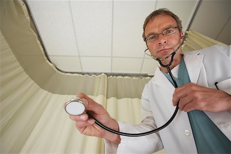 simsearch:600-01235402,k - Doctor with Stethoscope Stock Photo - Premium Royalty-Free, Code: 600-01199663