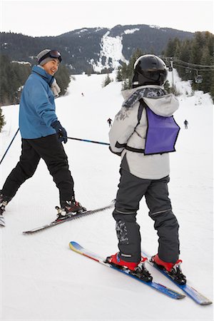 simsearch:600-01224168,k - Man and Boy on Ski Hill, Whistler, British Columbia, Canada Stock Photo - Premium Royalty-Free, Code: 600-01224120