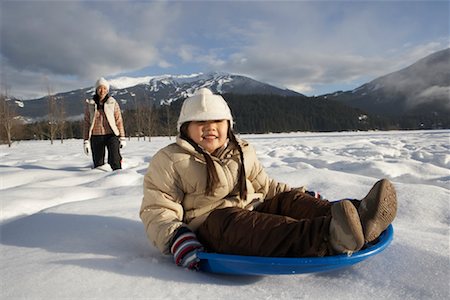 simsearch:600-01224168,k - Mother and Daughter Sledding, Whistler, British Columbia, Canada Stock Photo - Premium Royalty-Free, Code: 600-01224159
