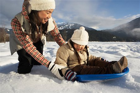 simsearch:600-01224168,k - Mother and Daughter Sledding, Whistler, British Columbia, Canada Stock Photo - Premium Royalty-Free, Code: 600-01224160