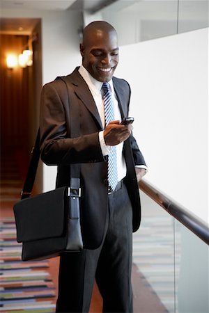 simsearch:700-00281308,k - Businessman with Cellular Phone Stock Photo - Premium Royalty-Free, Code: 600-01235317