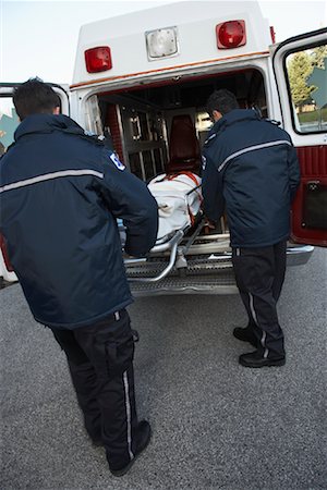 simsearch:700-00090429,k - Paramedics Removing Patient From Ambulance Stock Photo - Premium Royalty-Free, Code: 600-01235365