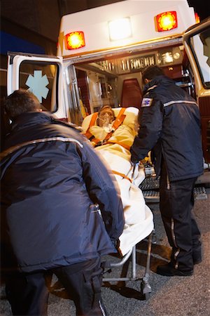 simsearch:700-00090429,k - Paramedics Removing Patient From Ambulance Stock Photo - Premium Royalty-Free, Code: 600-01235370