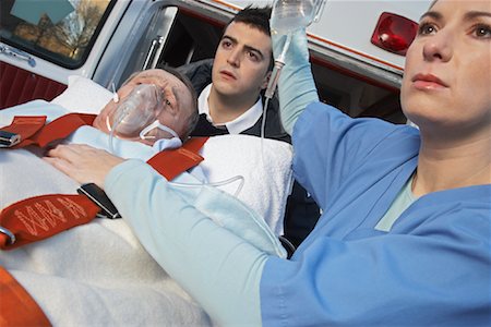 simsearch:700-00090429,k - Paramedic and Doctor with Patient on Stretcher Stock Photo - Premium Royalty-Free, Code: 600-01235387