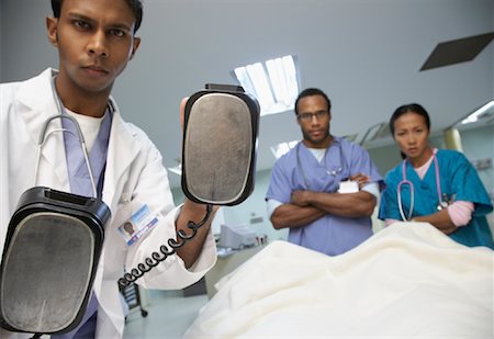 sick black woman - Medical Team Treating Patient Stock Photo - Premium Royalty-Free, Code: 600-01235412