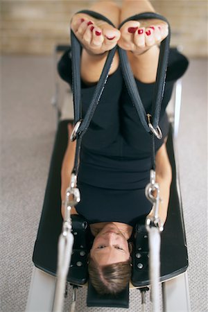 simsearch:600-00955031,k - Woman on Exercise Machine Stock Photo - Premium Royalty-Free, Code: 600-01235865