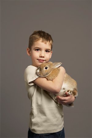 simsearch:700-01236595,k - Portrait of Boy Holding Rabbit Stock Photo - Premium Royalty-Free, Code: 600-01236612