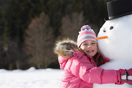 simsearch:600-01248341,k - Girl Hugging Snowman Foto de stock - Sin royalties Premium, Código: 600-01248340