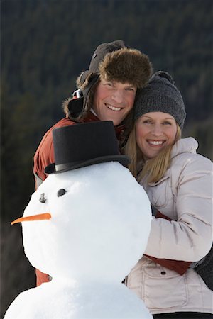 simsearch:600-01248341,k - Portrait of Couple and Snowman Foto de stock - Sin royalties Premium, Código: 600-01248341