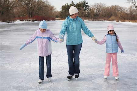 Mother and Daughters Skating Stock Photo - Premium Royalty-Free, Code: 600-01249385