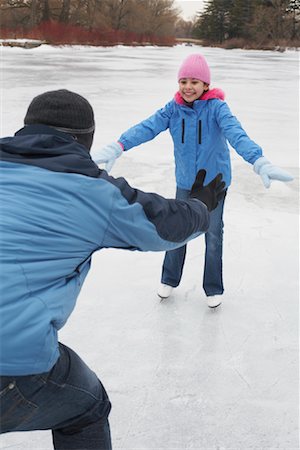 simsearch:600-01717666,k - Father Teaching Daughter to Skate Stock Photo - Premium Royalty-Free, Code: 600-01249396