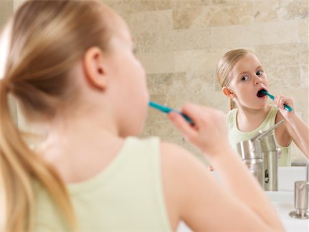 Girl Brushing Her Teeth Stock Photo - Premium Royalty-Free, Code: 600-01260380