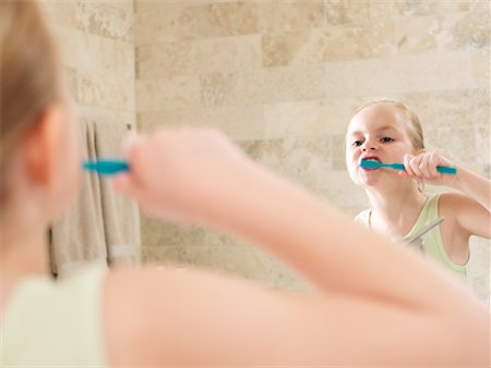 Girl Brushing Her Teeth Stock Photo - Premium Royalty-Free, Code: 600-01260381