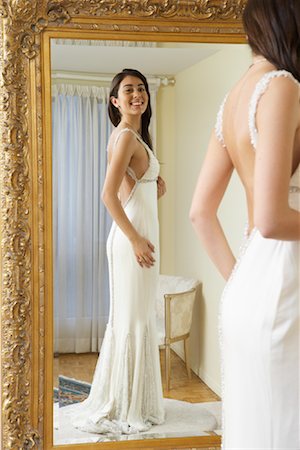 simsearch:600-02200222,k - Woman Trying on Wedding Gown Stock Photo - Premium Royalty-Free, Code: 600-01276336