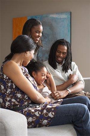 Family on Sofa Stock Photo - Premium Royalty-Free, Code: 600-01276419