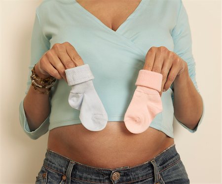 expectant parent - Woman Holding Baby Socks Stock Photo - Premium Royalty-Free, Code: 600-01296090