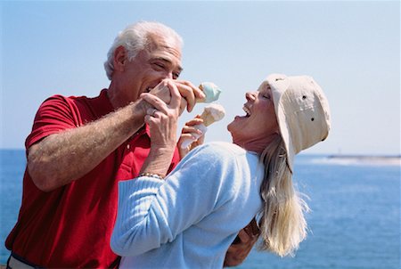 forced smile - Couple Eating Ice Cream Cones Stock Photo - Premium Royalty-Free, Code: 600-01296379