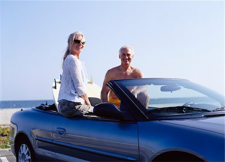 simsearch:700-00439935,k - Couple in Convertible Car with Surfboards Stock Photo - Premium Royalty-Free, Code: 600-01296400