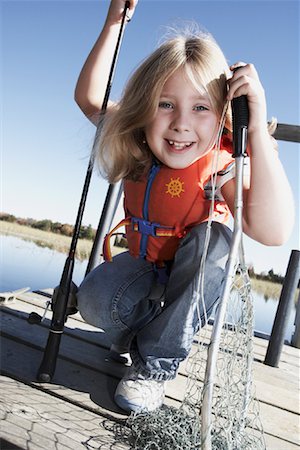 Portrait of Girl Fishing Stock Photo - Premium Royalty-Free, Code: 600-01296520
