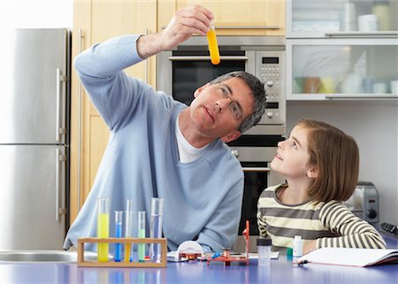 simsearch:700-01345033,k - Father Helping Daughter With Homework Stock Photo - Premium Royalty-Free, Code: 600-01374084