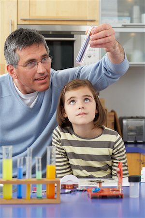 simsearch:700-01345033,k - Father Helping Daughter With Homework Stock Photo - Premium Royalty-Free, Code: 600-01374085