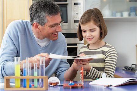 simsearch:6108-06166629,k - Father Helping Daughter With Homework Stock Photo - Premium Royalty-Free, Code: 600-01374082