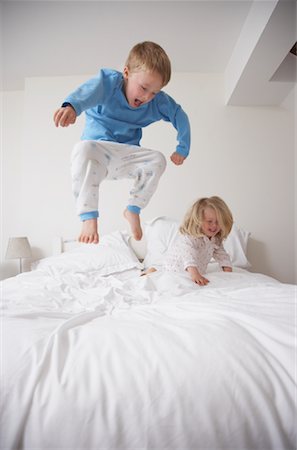 photo boys jumping bed - Children Jumping on Bed Stock Photo - Premium Royalty-Free, Code: 600-01374192