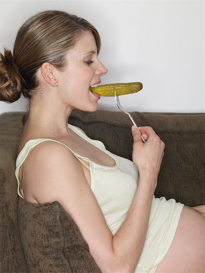 pregnant woman eating. Pregnant Woman Eating Pickle