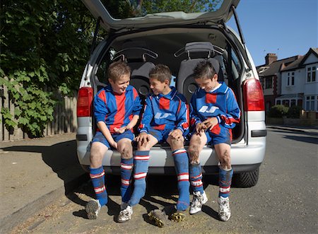 Soccer Players Removing Shoes Stock Photo - Premium Royalty-Free, Code: 600-01374837