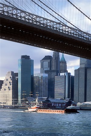 Barge Passing Under Brooklyn Bridge, New York City, New York, USA Stock Photo - Premium Royalty-Free, Code: 600-01378756