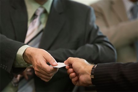 Businessmen Exchanging Card Stock Photo - Premium Royalty-Free, Code: 600-01407328