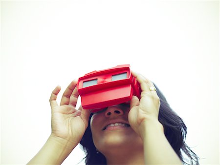 Woman Using View Master Stock Photo - Premium Royalty-Free, Code: 600-01429336