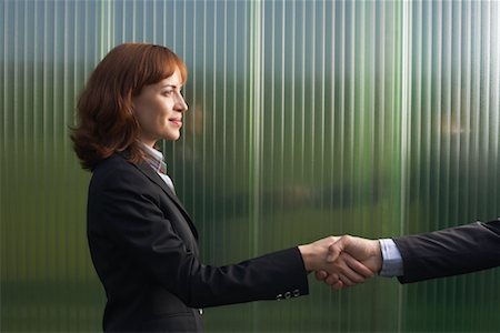 simsearch:600-01464382,k - Businesswoman and Businessman Greeting Stock Photo - Premium Royalty-Free, Code: 600-01464371