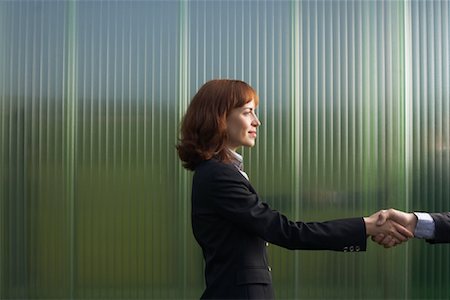 simsearch:600-01464382,k - Businesswoman and Businessman Greeting Stock Photo - Premium Royalty-Free, Code: 600-01464372