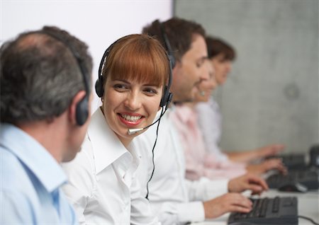 Business People Working at Computers with Headsets Stock Photo - Premium Royalty-Free, Code: 600-01464430