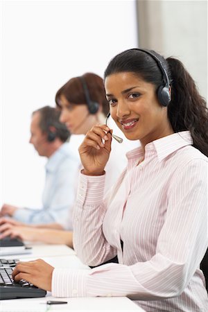 Business People Working on Computers with Headsets Stock Photo - Premium Royalty-Free, Code: 600-01464442
