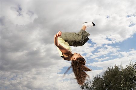 flipped - Girl Doing Somersaults Stock Photo - Premium Royalty-Free, Code: 600-01540626