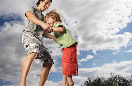 simsearch:700-00520129,k - Father and Son Jumping Stock Photo - Premium Royalty-Free, Code: 600-01540627